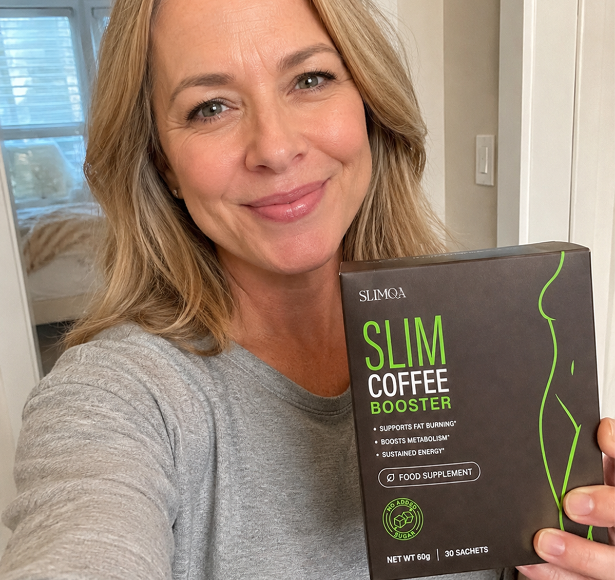 Smiling woman holding a box of Slimqa Slim Coffee Booster for weight management